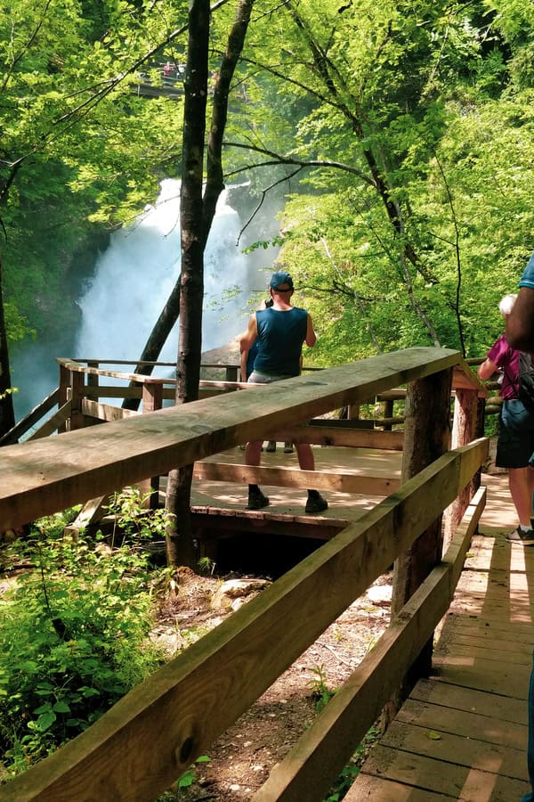travelers photographing sum waterfall soteska vintgar