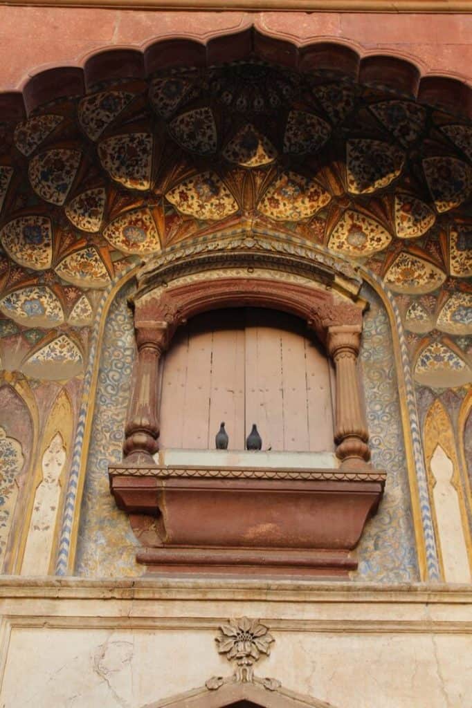 the tomb of safdarjung main gate window pigeons