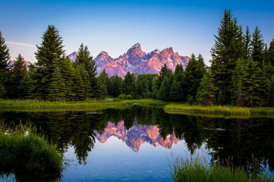 sunrise over grand teton national park the best national parks in the usa
