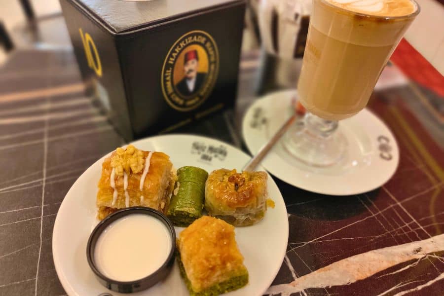 a plate of baklava and a cup of coffee at hafiz mustafa 1864 