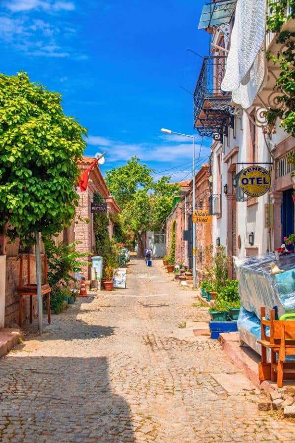 cobbled street lined with historic houses in ayvalik turkey