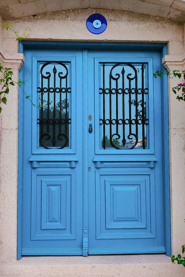 stone house with a blue door alacati turkey