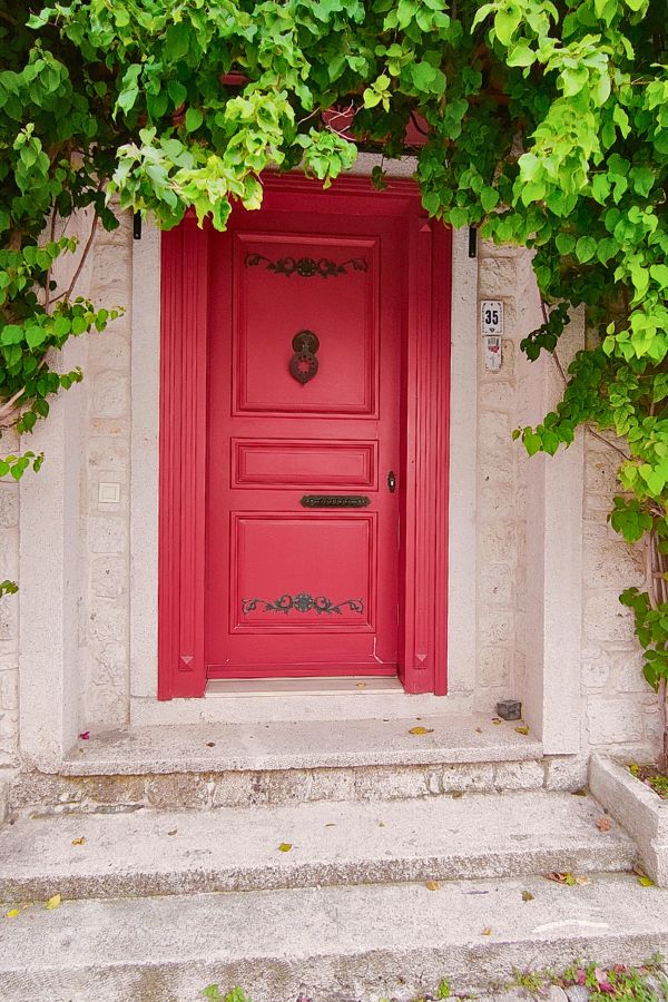 stone house with a red door alacati turkey