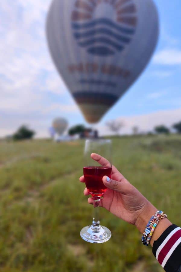 celebrating with champagne after hot air balloon in cappadocia