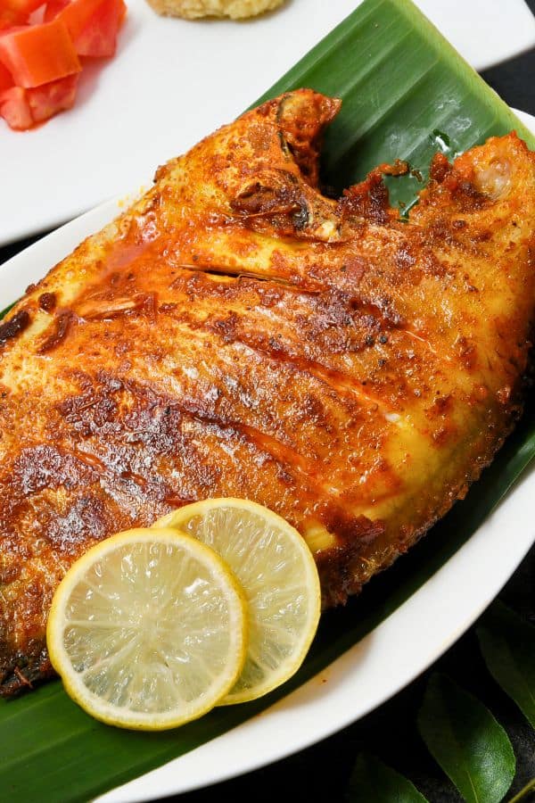 seafood karimeen pollichathu banana leaf pearlspot fish traditional cuisine kerala
