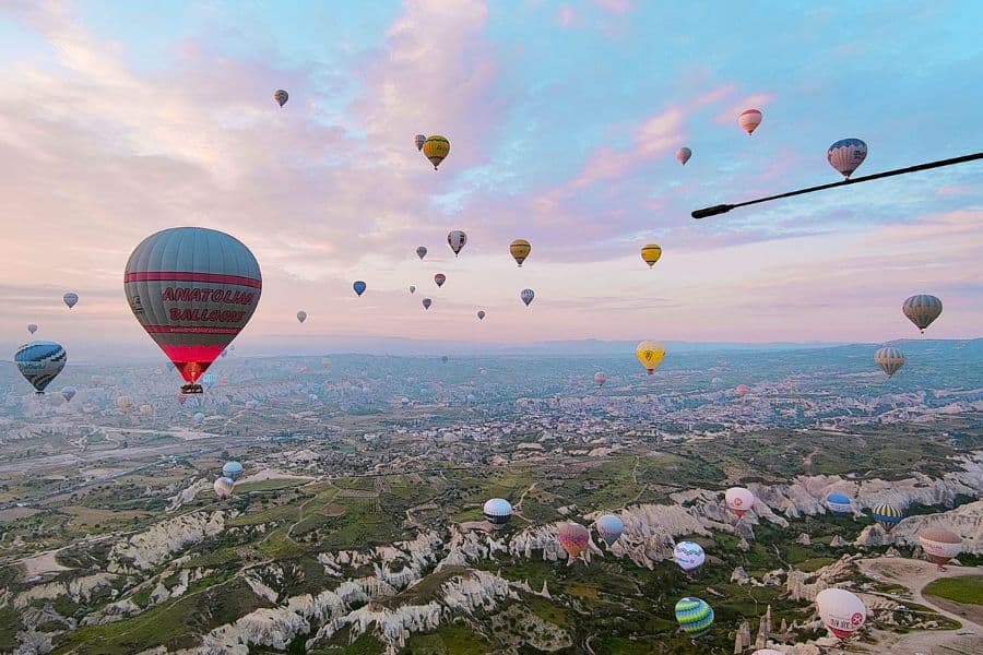 hot air balloon during sunrise over love valley