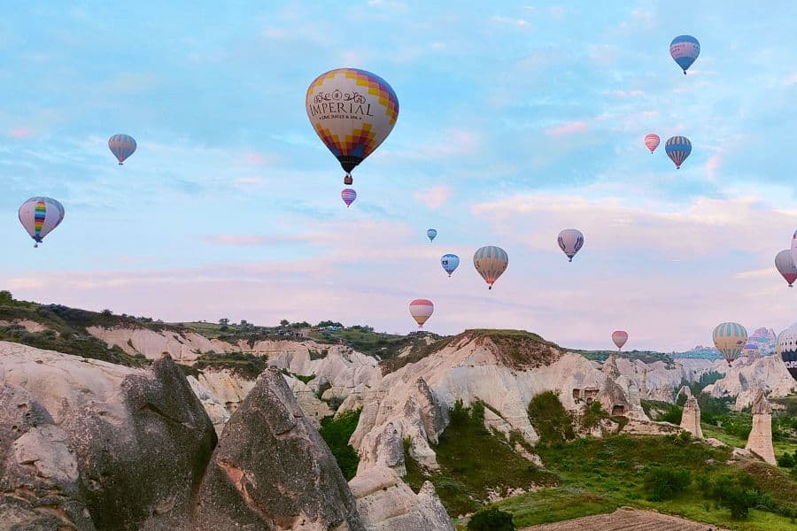 hot air balloons floating over love valley in cappadocia