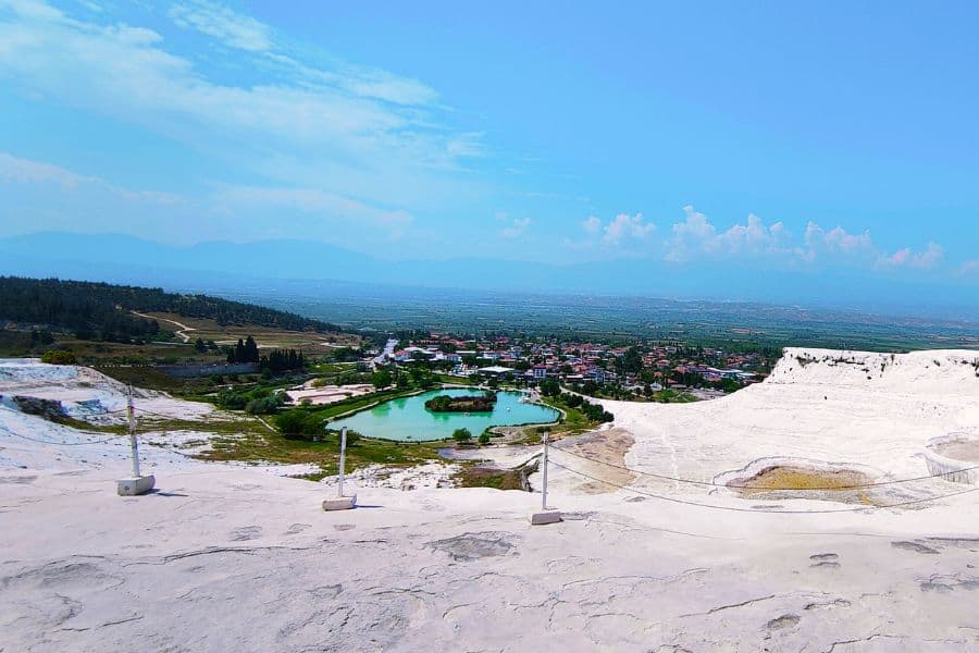 pamukkale natural park and the town of pamukkale as seen from the top of thermal pools