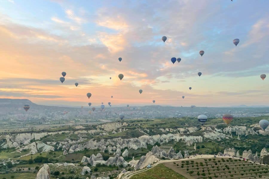 sky filled with hot air balloons in cappadocia