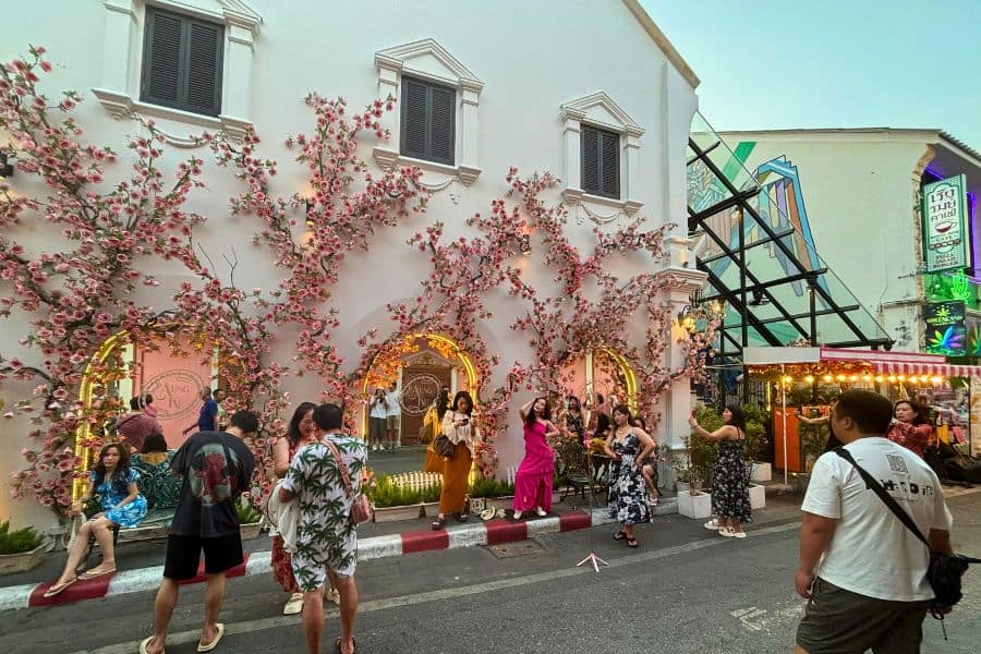 flower-clad building at vibrant soi romanee in phuket old town