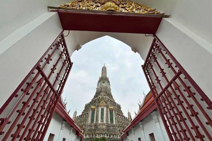 stunning view of wat arun temple on the banks of chao phraya river, an iconic stop on any Thailand itinerary