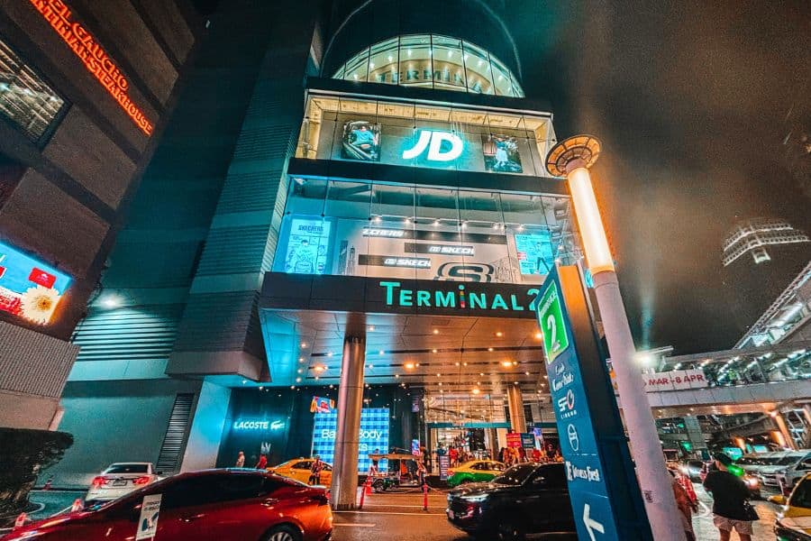 the outer facade of terminal 21 shopping mall in sukhumvit at night 
