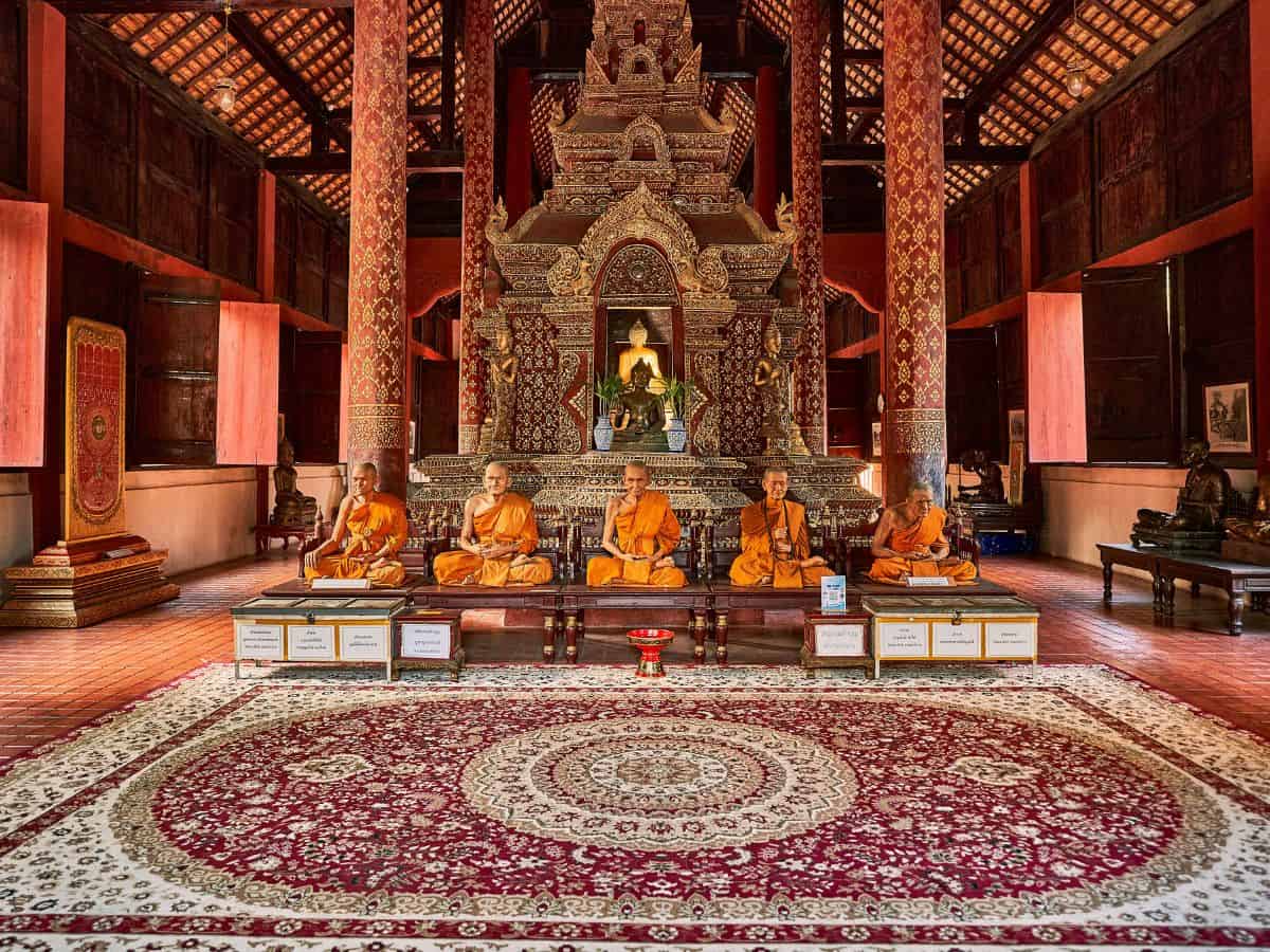 statues of monks that look lke real monks inside ubosot aka ordination hall of wat phra singh in chiang mai