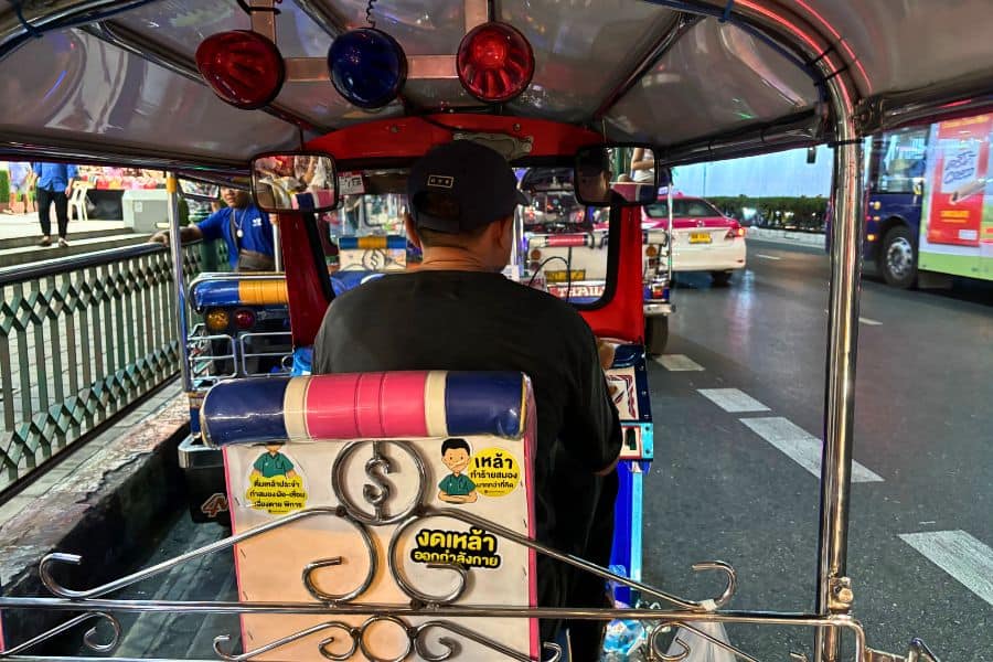view from inside a tuk-tuk on a busy street in bangkok thailand