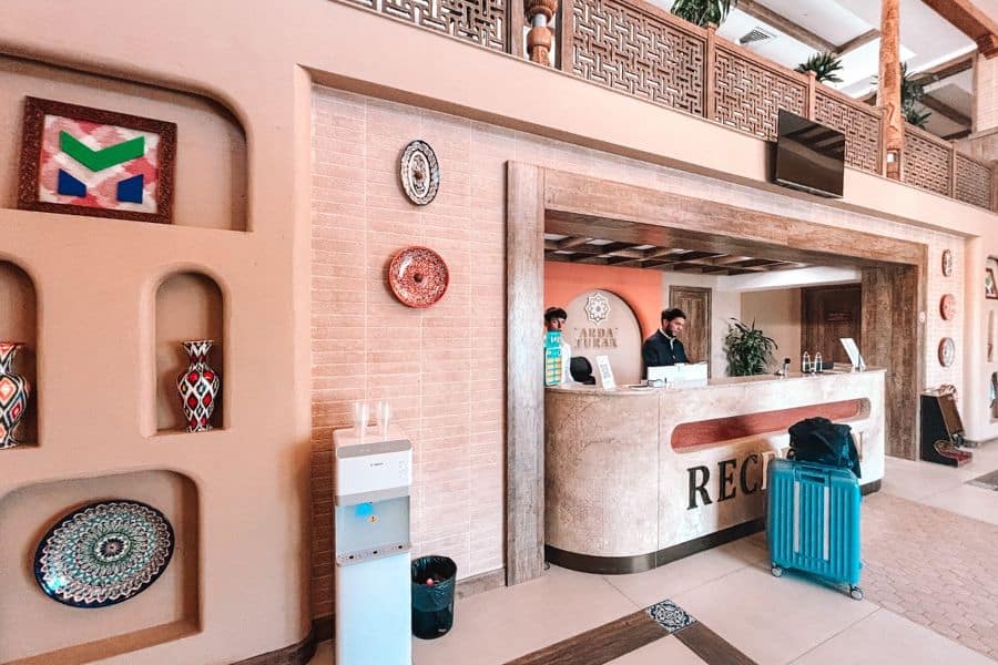 arda turan hotel reception area in khiva with traditional decor and front desk