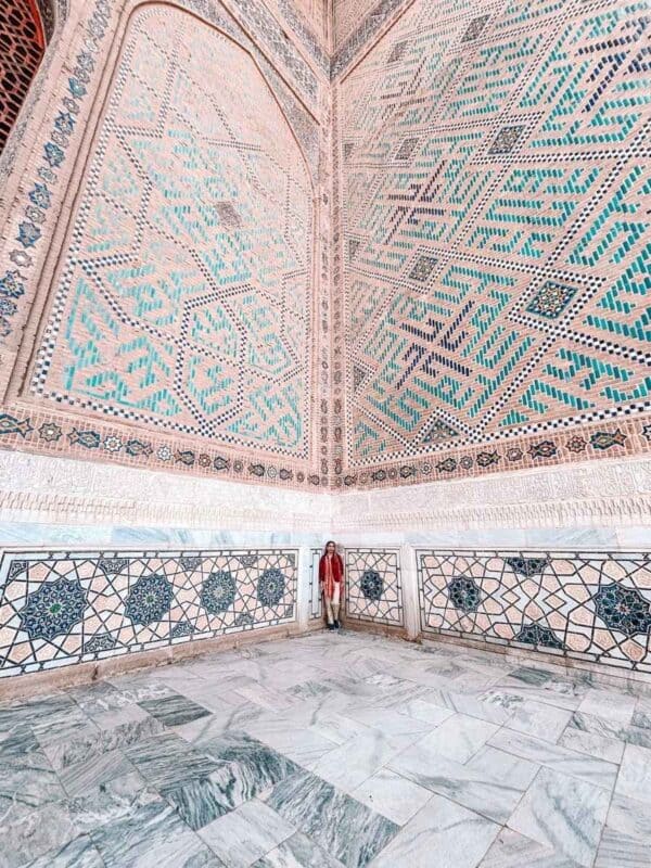 me standing inside bibi khanym mosque courtyard with turquoise geometric tilework