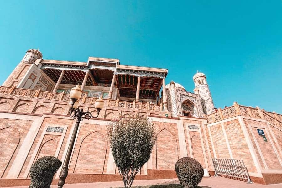 hazrat khizr mosque exterior with terrace, minaret and blue sky in samarkand