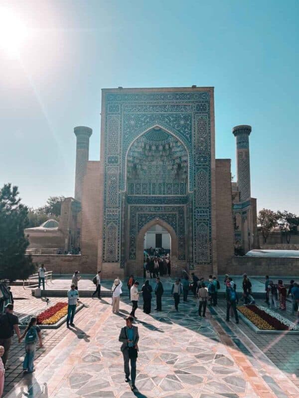 gur-e-amir mausoleum entrance in samarkand with visitors
