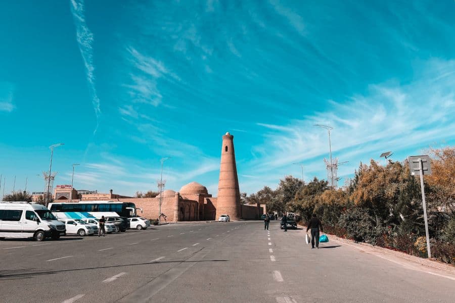 islam khoja minaret outside itchan kala khiva with road and surrounding buildings