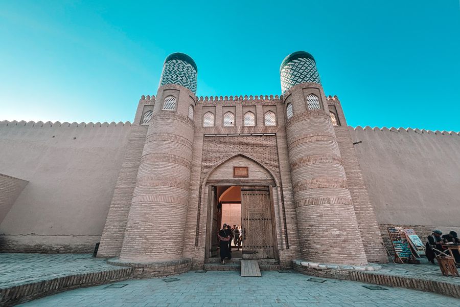 entrance of kunya ark in itchan kala khiva with twin towers and mud brick walls