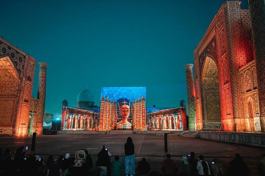 registan square at night during light and sound show in samarkand