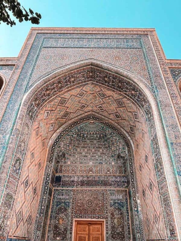 detailed iwan entrance of ulugh beg madrasah with geometric brickwork and tile patterns at registan