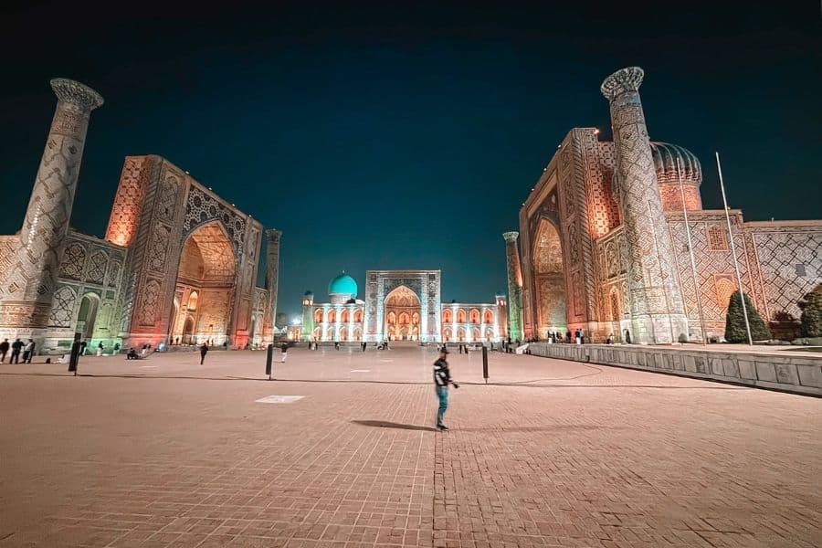 registan square at night with illuminated madrasahs in samarkand