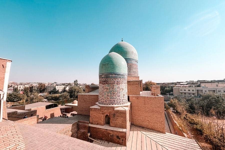 shahi zinda necropolis with turquoise domes overlooking samarkand
