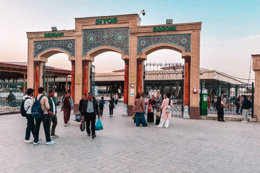 main gate of siab bazaar in samarkand with shoppers entering