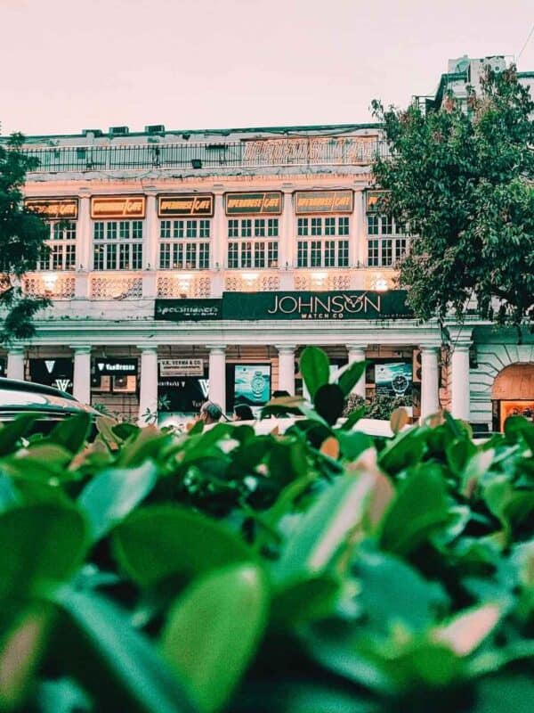 white colonial-style building in connaught place with openhouse cafe signage