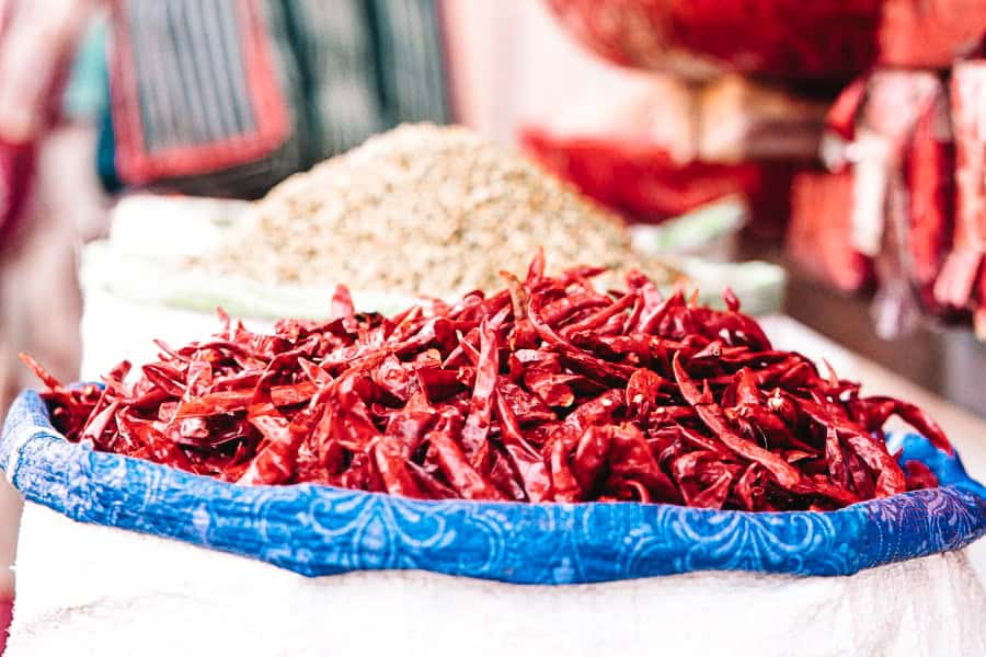 dried red chillies and other spices at display at khari baoli spice market in chandni chowk delhi