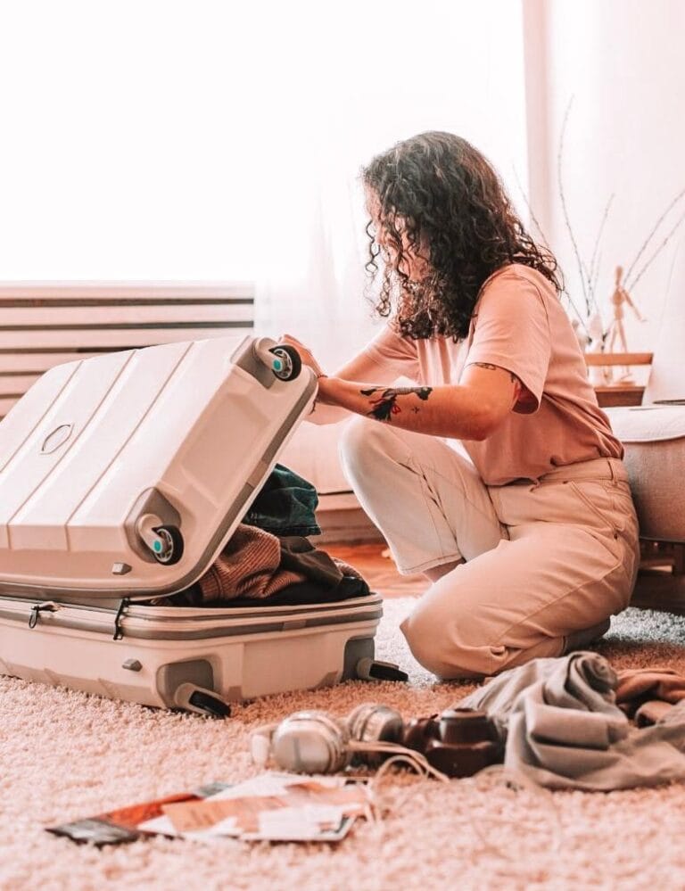 girl packing a suitcase for traveling