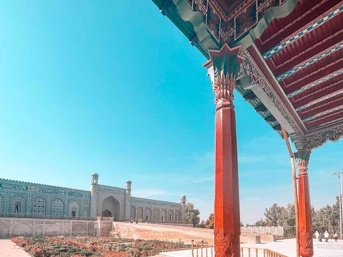 khudoyar khan palace in kokand in fergana valley with carved wooden columns and a bright clear sky