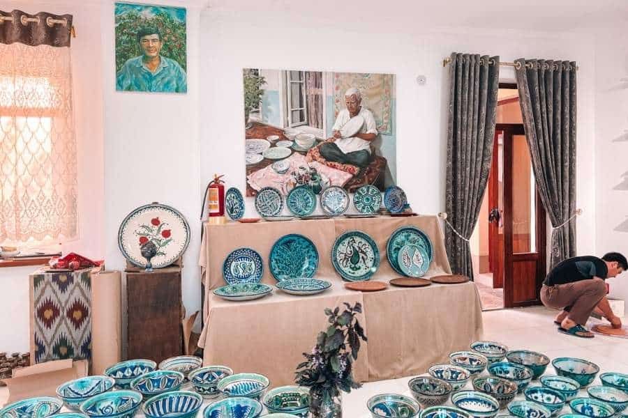 blue pottery display inside sharofiddin yusupov ceramics workshop in rishtan fergana valley